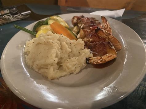 Bacon-wrapped shrimp and a causeway view at Pirate's Landing in Port ...