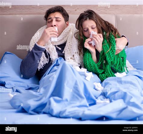 The sick wife and husband in bed in home Stock Photo - Alamy