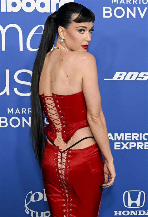 Katy Perry Flashes Her Thong and Backside in Red Lace-Up Skirt