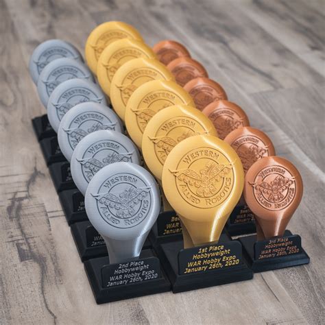 I designed and 3D printed these trophies for the upcoming WAR event ...