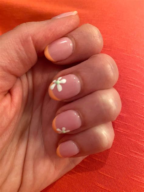 Orange French Tips Nails Manicure With Flowers Design - Vibrant Guide