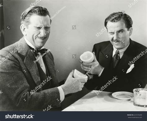 Two Men Squirting Grapefruit Juice Each Stock Photo 227270299 ...