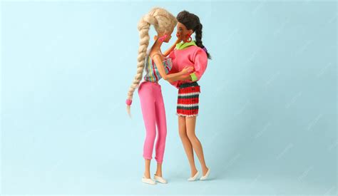 Premium Photo | Odessa ukraine june 1 2021 two lesbian barbie dolls kiss on a blue background