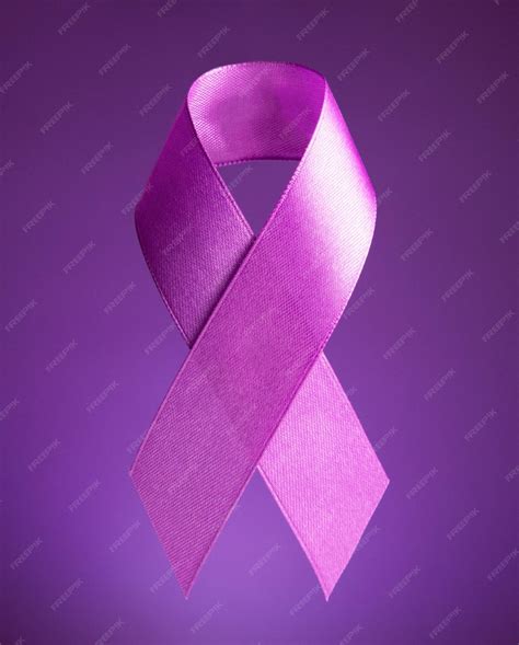 Premium Photo | World cancer day purple ribbon on a purple background ...
