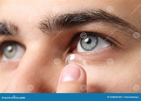 Closeup View of Young Man Putting in Contact Lens Stock Image - Image ...