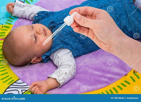 Newborn Gets Nose Drops with Saline Solution Stock Photo - Image of ...
