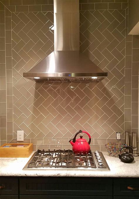Stunning Herringbone Pattern Smoke Glass Subway Tile Backsplash