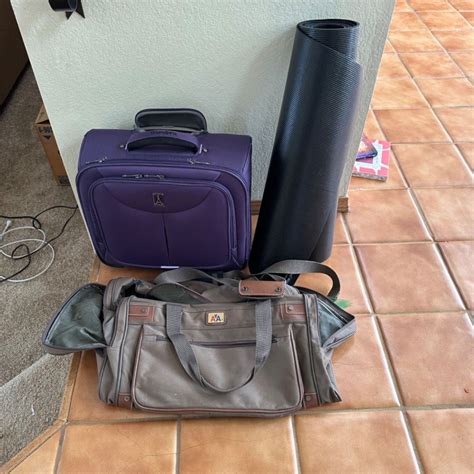 Lot #471 - American Airlines luggage and floor mat - SLOCAL Estate ...