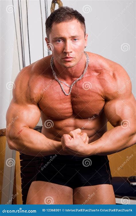 Bodybuilder posing stock image. Image of competition - 12368301