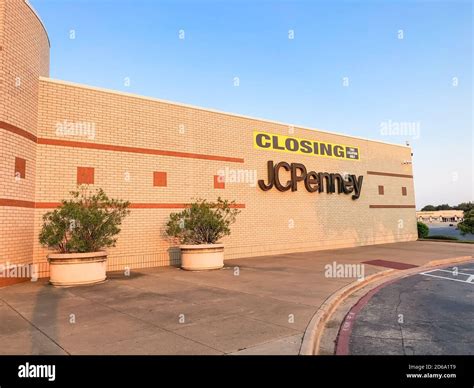 Closing sign at facade building of J.C. Penney retail store in shopping ...
