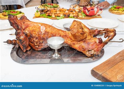 Rabbit on a Spit on the Grill Roasts Stock Photo - Image of gourmet, grilled: 154808220