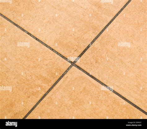 Brown ceramic floor tiles close up texture Stock Photo - Alamy