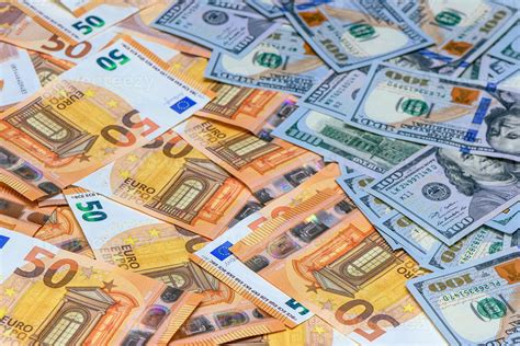 50 euros on top of one hundred dollar bills. Trading Euro with Dollar ...