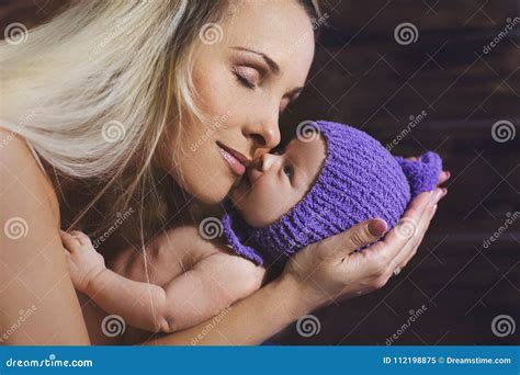 Mother cradling her baby stock image. Image of family - 112198875