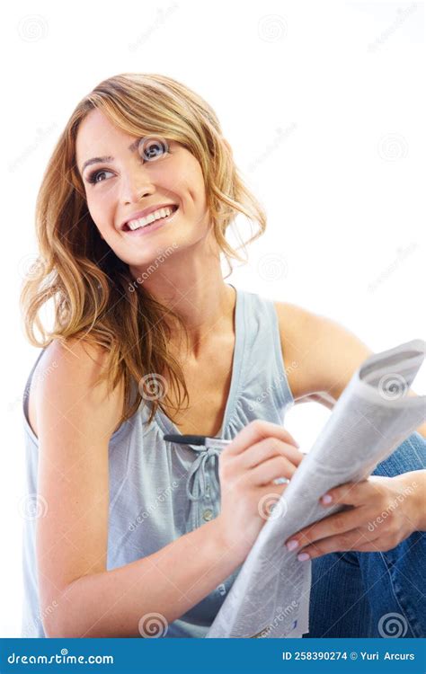 Crosswords are a Cure for Boredom. a Pretty Young Woman Doing a ...