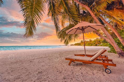 Beautiful beach. Chairs on the sandy beach near the sea. Summer holiday ...