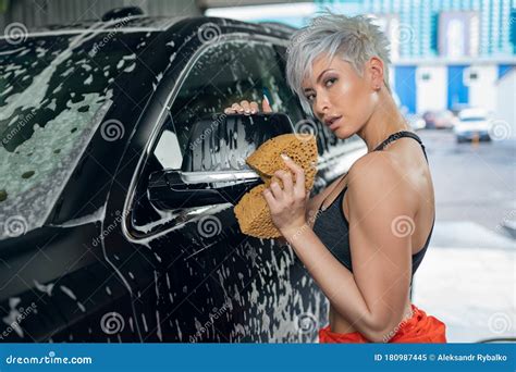 Young Woman Washes a Car in a Car Wash Stock Image - Image of caucasian, lifestyle: 180987445