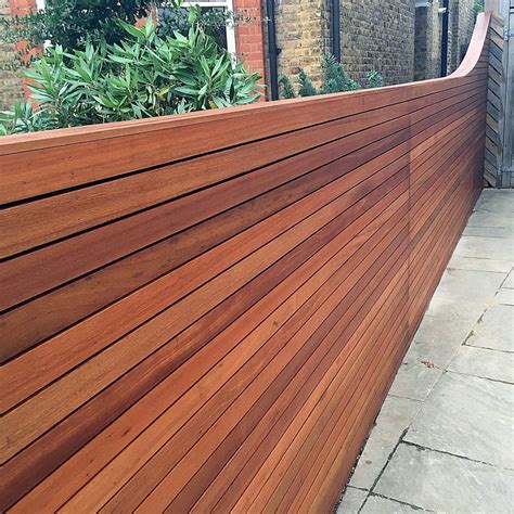 Horizontal cedar hardwood strip wood trellis screen fence oiled curved ...