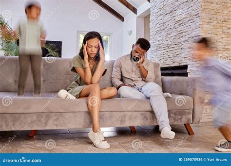 Kids, Stress and Headache with a Black Couple in the Living Room of a House while Crazy Adhd ...