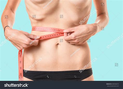 Underweight Young Woman Measuring Her Waist Stock Photo 484566073 | Shutterstock