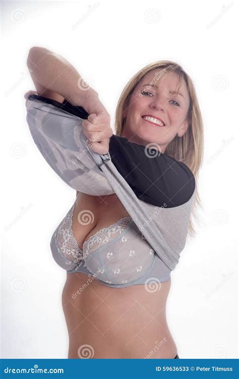 Woman Removing Her Clothing Stock Image - Image of clothes, dressed ...