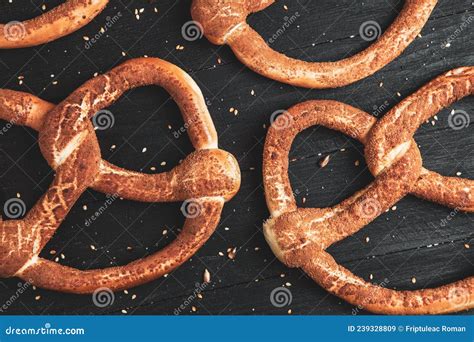 Different Types of Baked Pretzels with Seeds on a Black Background ...