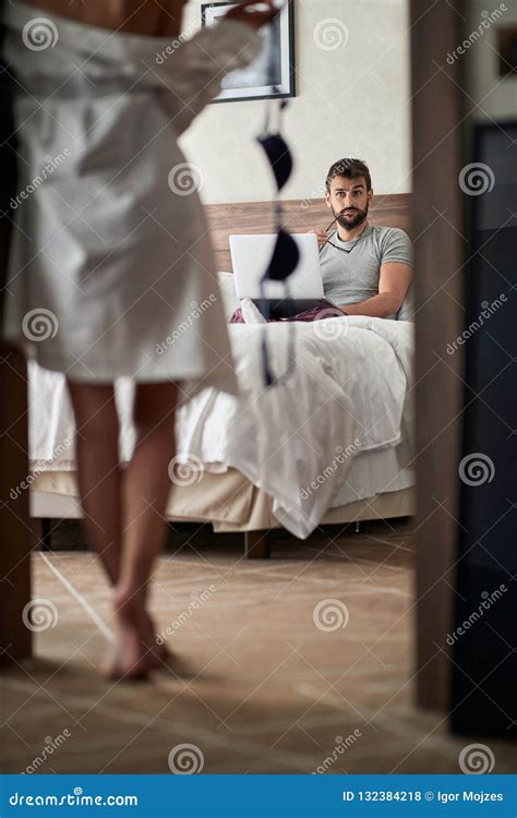 Time for Sex - Woman Seduces Her Boyfriend in the Bedroom Stock Photo ...