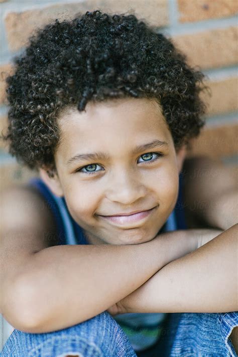 "Handsome Latino Boy" by Stocksy Contributor "Raymond Forbes LLC" - Stocksy