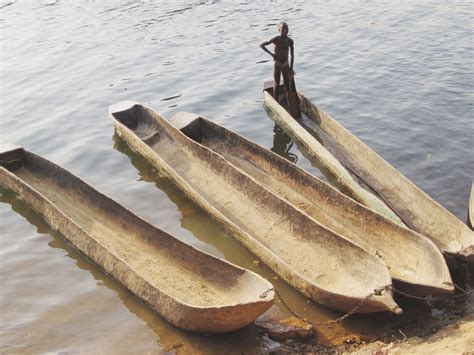 Sierra Leone. Dugout canoes for river fishing. Photo by Jim Gonia ...