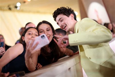 Ariana Grande, Timothee Chalamet and other candid celebrity moments on Oscars red carpet