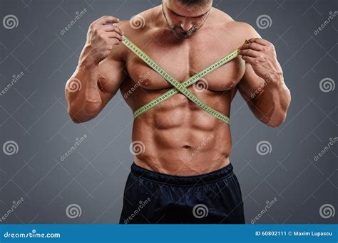 Bodybuilder Measuring Waist with Tape Measure Stock Image - Image of ...