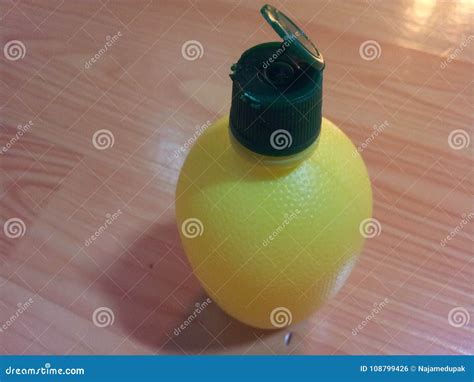 Lemon Juice Bottle with Green Cap Stock Photo - Image of lime, juicy ...