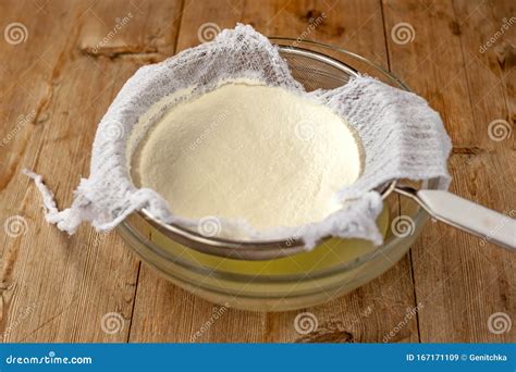 Cooking Homemade Cottage Cheese, Cheese Curd Product. Draining of ...