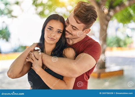 Man and Woman Couple Smiling Confident Hugging Each Other at Park Stock ...