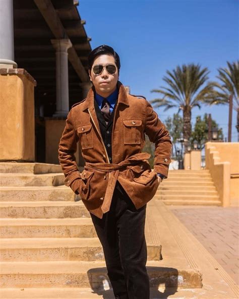 Brown Corduroy Safari Jacket with Black Suit and Blue Shirt | Hockerty