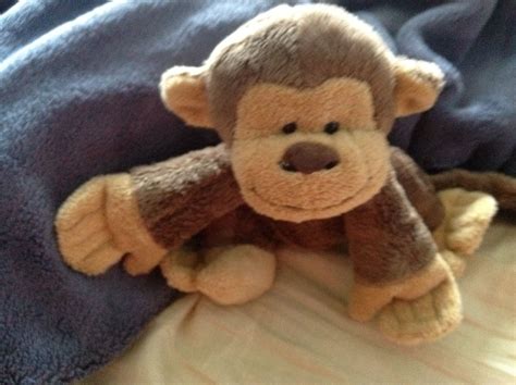 Stuffed Monkey on Bed