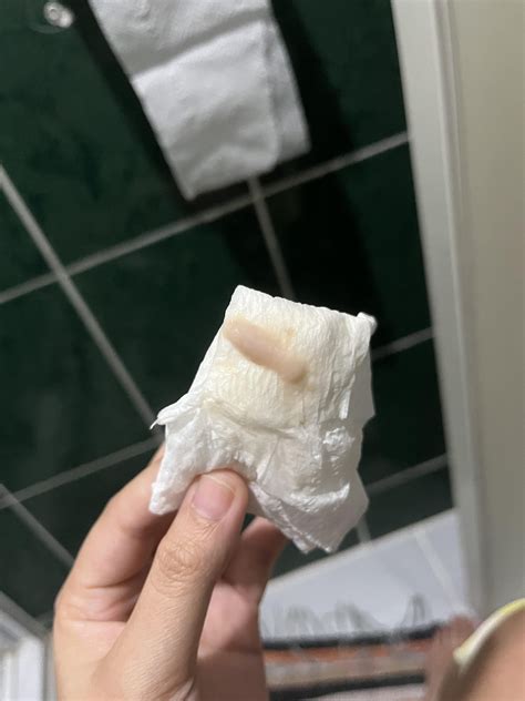 Creamy light pink discharge 1 week before period. : r/Periods