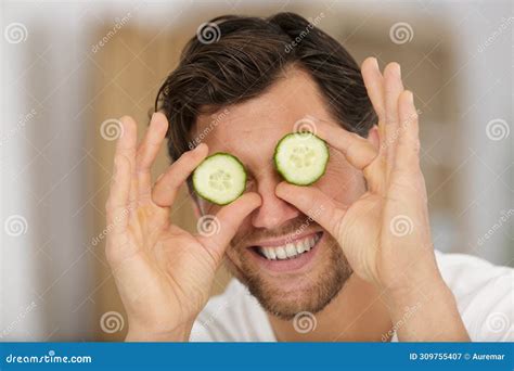 Playful Man Holding Slices Cucumber Over Eyes Stock Image - Image of ...