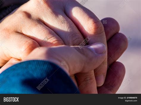 Girlfriend And Boyfriend Holding Hands