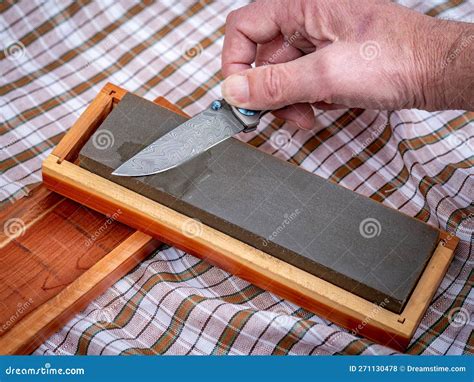 Pocket Knife with Unique Damascus Patter Getting a Sharpened Stock ...