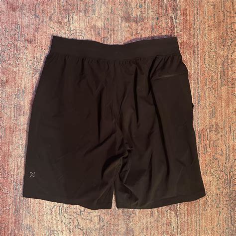 men's black lululemon athletic shorts tag ripped off... - Depop