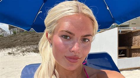 College basketball star Hannah White stuns in busty black bikini snaps as fans claim she's ...