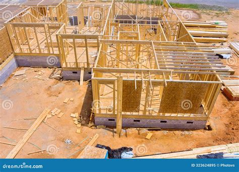 Under Construction, a New Home Roof Wall Includes Wooden Beams Framing ...