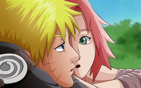 Download Sakura Looking At Naruto Wallpaper | Wallpapers.com