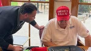 Trump and Iraq Envoy Mark Savaya pictured with Saddam-era coin - Iraqi News