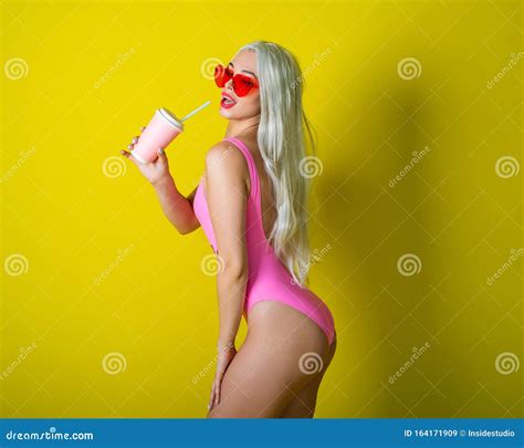 Blonde with a Beautiful Big Booty in a Pink Bathing Suit Drinks a Drink ...