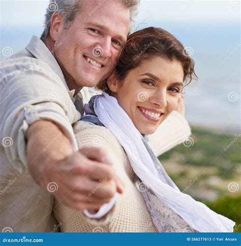 The World is Theirs. a Loving Mature Couple Standing with Their Arms ...