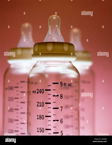 Baby feeding bottles with volume measurements printed in metric (ml ...