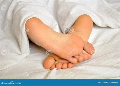Sleeping girl feet stock photo. Image of doze, blanket - 32104900