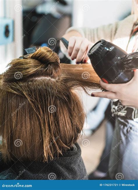 Closeup Shot of a Hairdresser Blow Drying a Woman S Short Hair in a ...